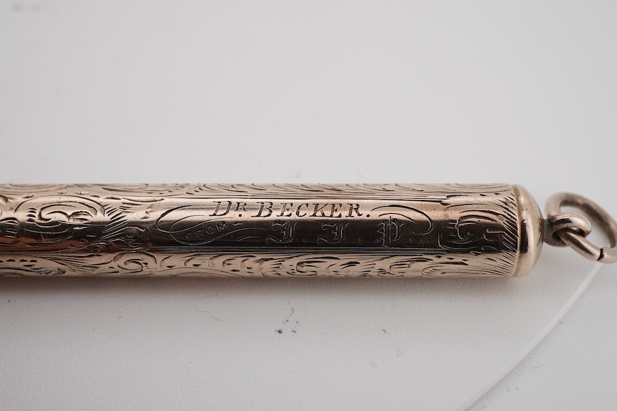 A 9ct gold propelling toothpick, 50mm and a yellow metal propelling pencil.